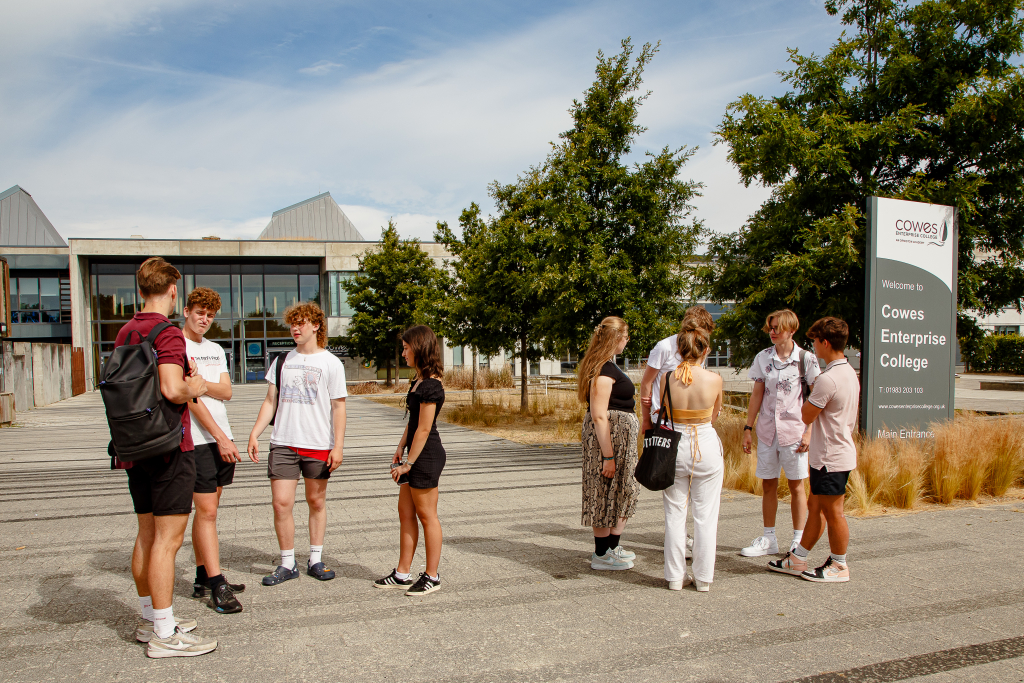 Group of sixth form students outside Cowes Enterprise College building